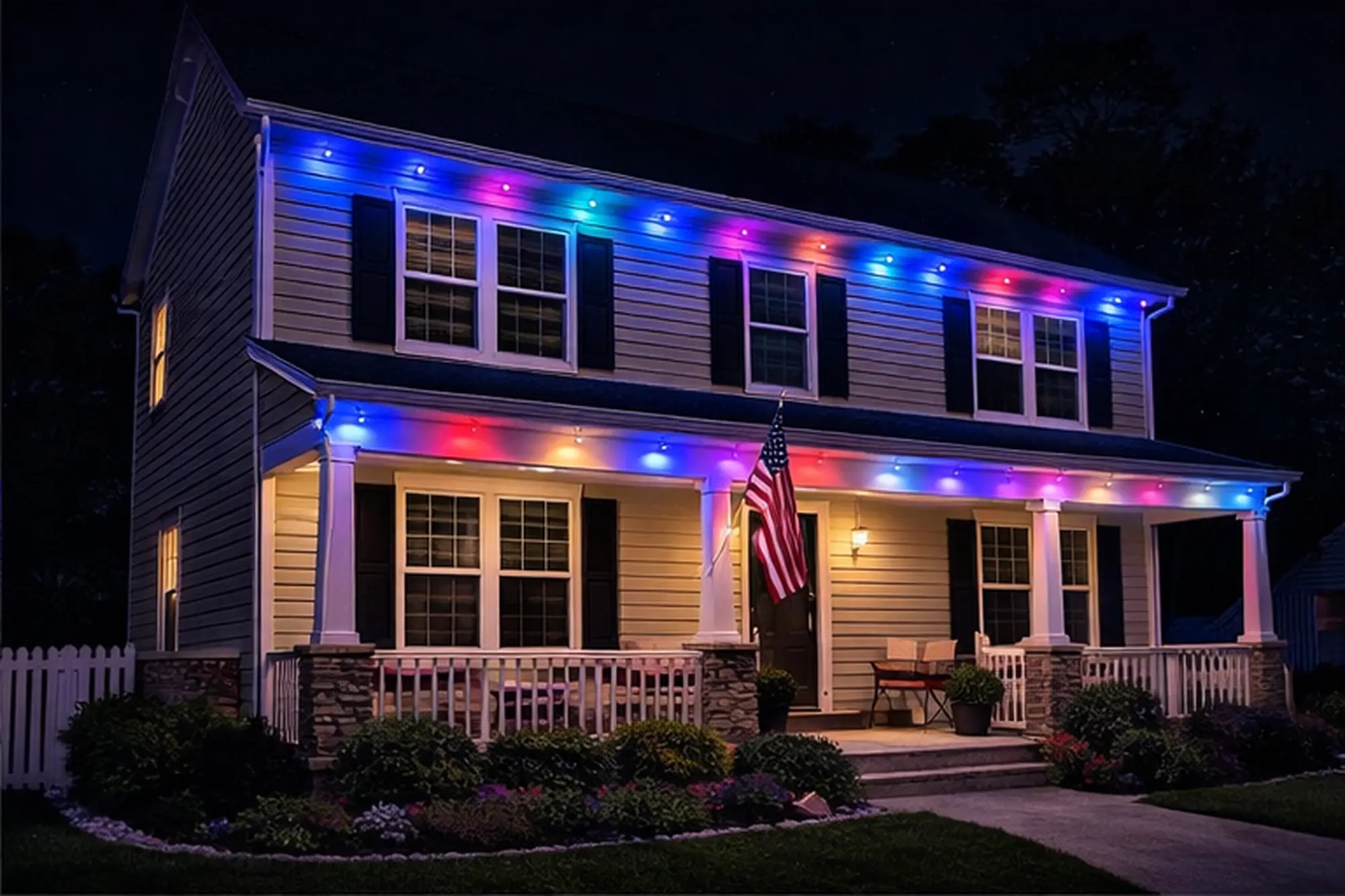 Two-story home with colorful permanent holiday lights